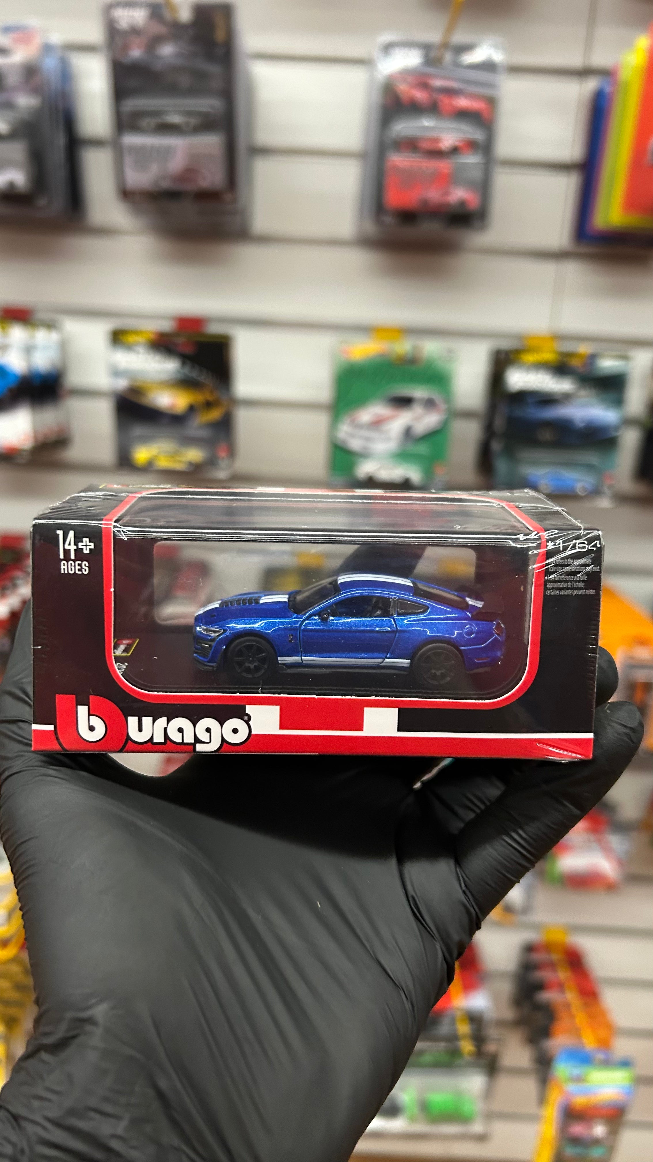 Blue Shelby Mustang GT500 diecast model on display base Cocoland Toys