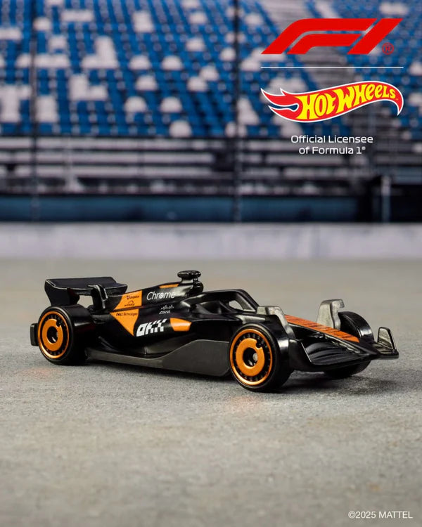 Cocoland Toyz Hot Wheels Formula 1 race car with orange accents side view